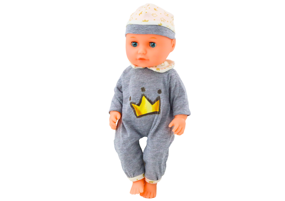 Babydocka i grå pyjamas med flaska och ljud